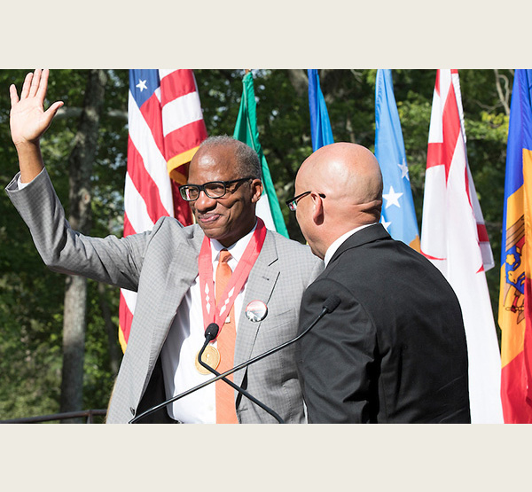 Miami President Gregory Crawford awarded the President's Medal to Wil Haygood in 2018.