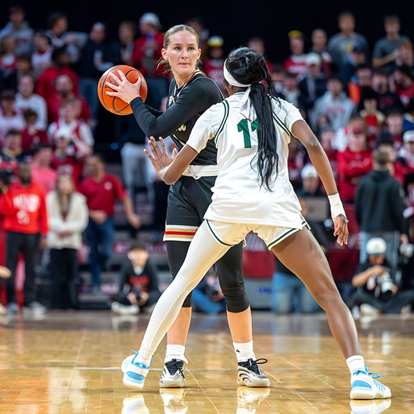 Amber Scalia, a senior guard, plans her next move during the One Miami game at Millett against Ohio University (photo by Scott Kissell).
