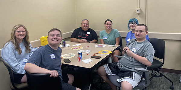 Lunch Bunch activities include coloring, games, and a pizza party. The Lunch Bunch initiative started at Miami University in 2023.